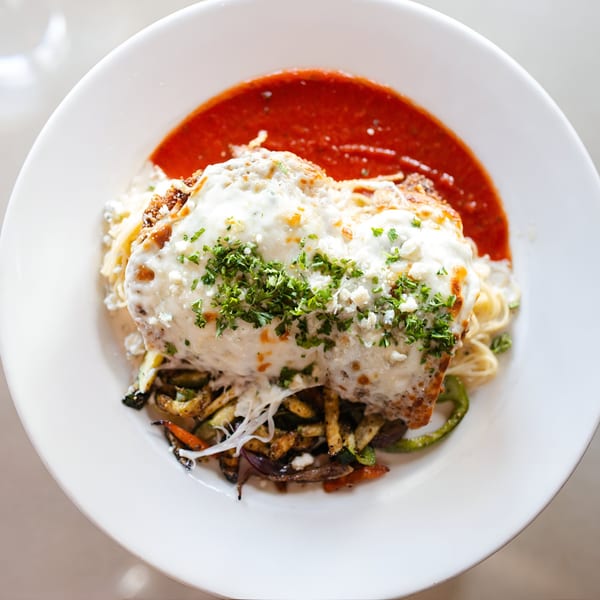 Italian Kitchen's chicken parmesan with spaghetti, red sauce, and mixed vegetables.
